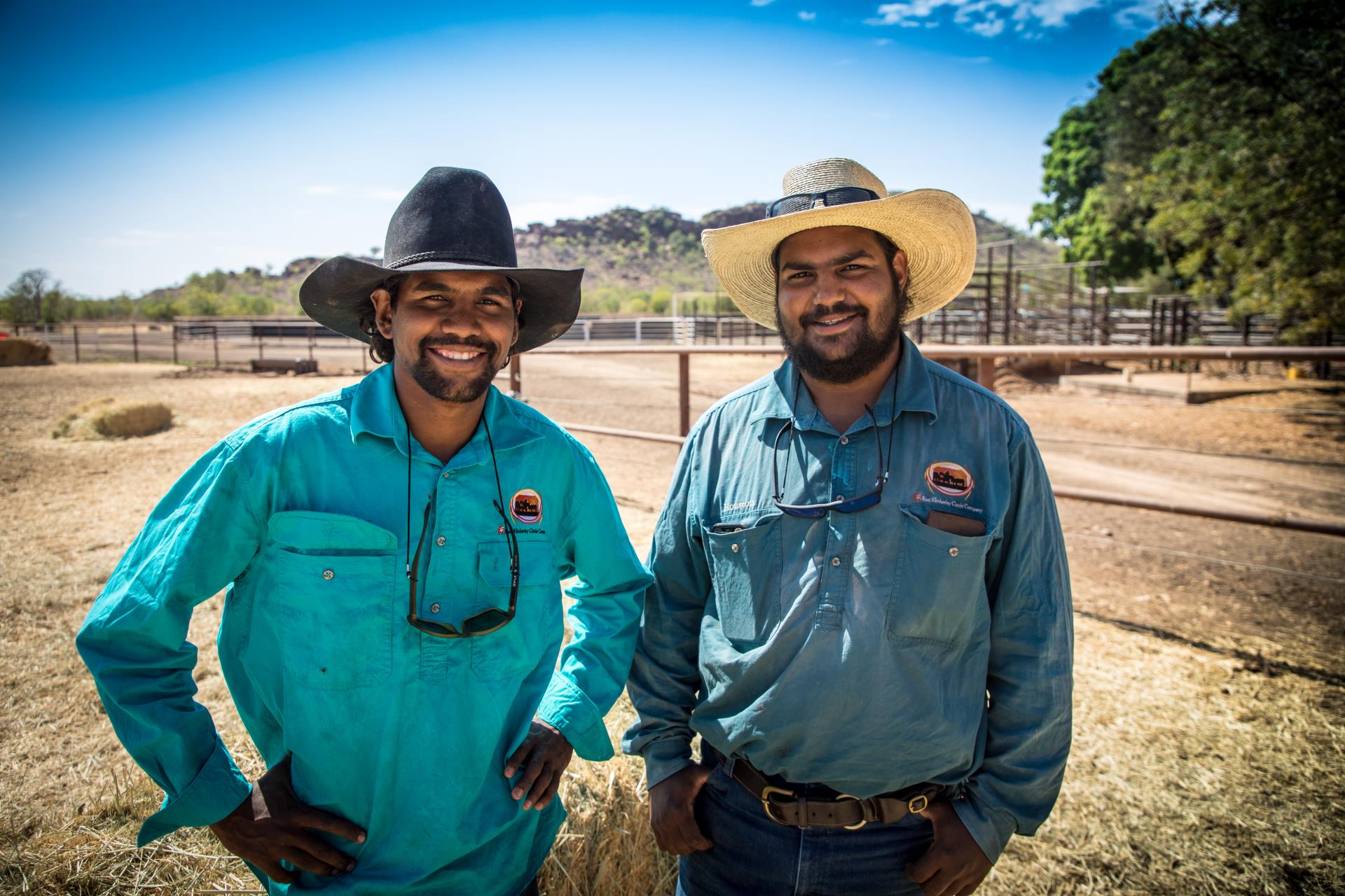 Two men smiling